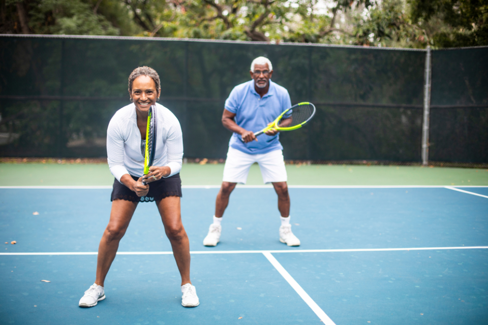 Couple playing tennis
